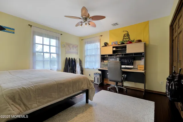 a bathroom with a sink and a potted plant