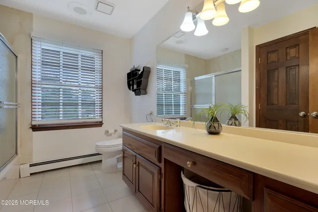 a kitchen with stainless steel appliances kitchen island granite countertop a table and chairs in it