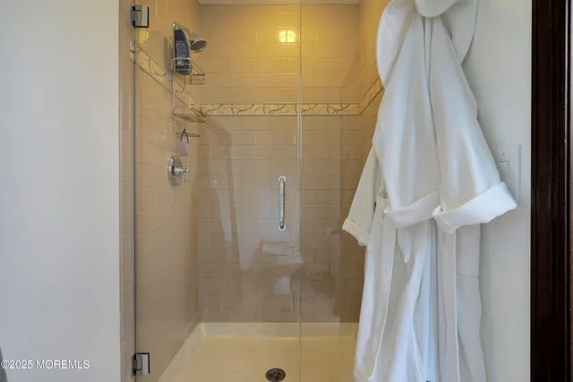 a view of a patio with table and chairs potted plants and large tree