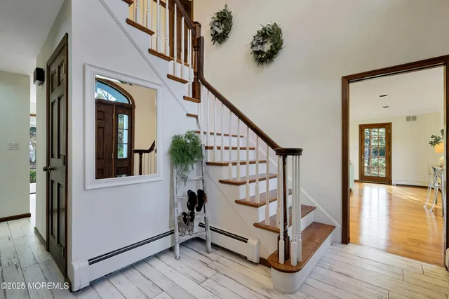 a view of entryway with wooden floor