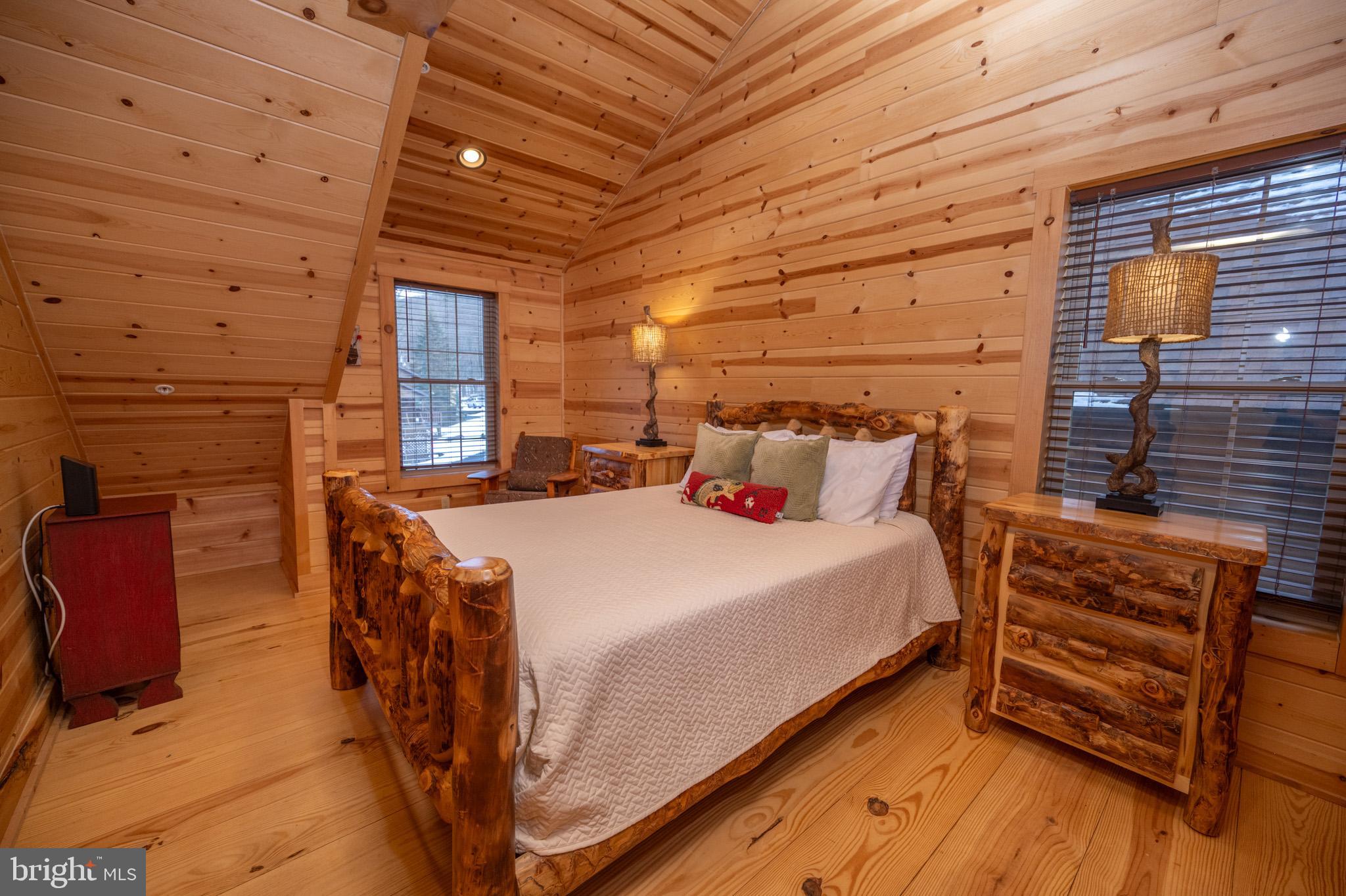 88 Gravelly Run Road McHenry, MD 21541 - Photo 43 of 79 a bed room with a bed and a chair