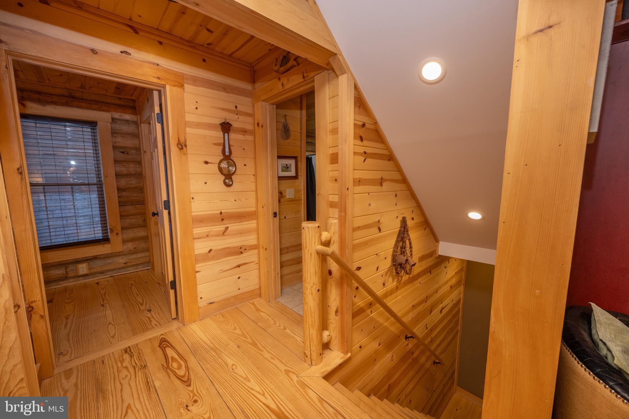 88 Gravelly Run Road McHenry, MD 21541 - Photo 50 of 79 a view of a hallway with wooden floor and staircase
