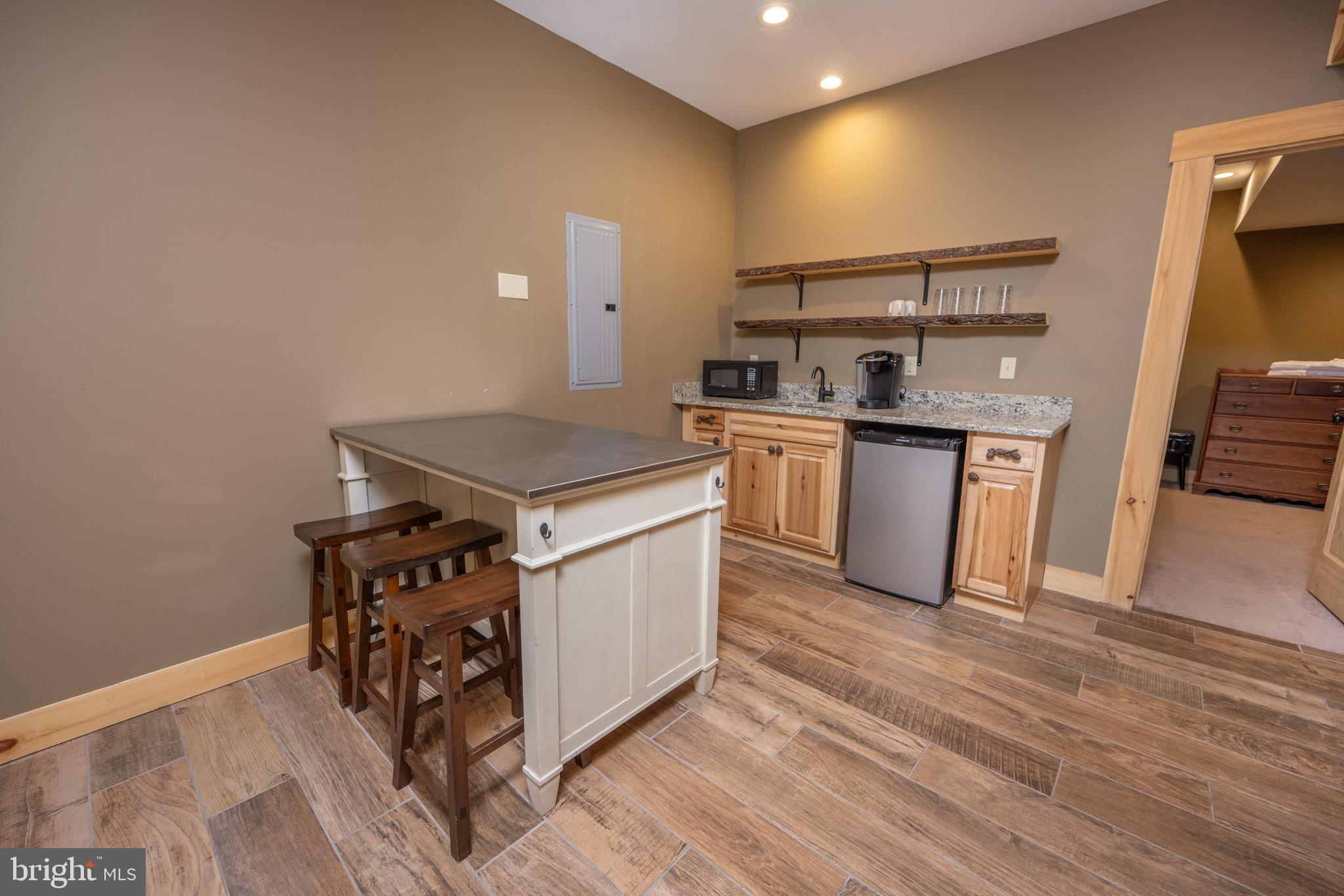 88 Gravelly Run Road McHenry, MD 21541 - Photo 56 of 79 a kitchen with stainless steel appliances granite countertop a stove and a sink