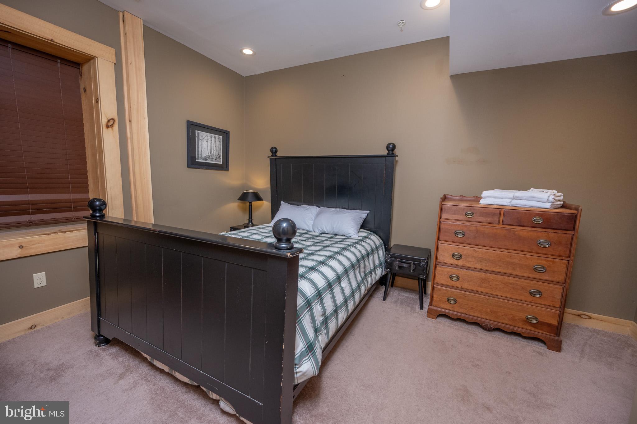 88 Gravelly Run Road McHenry, MD 21541 - Photo 58 of 79 a bedroom with a bed and a dresser