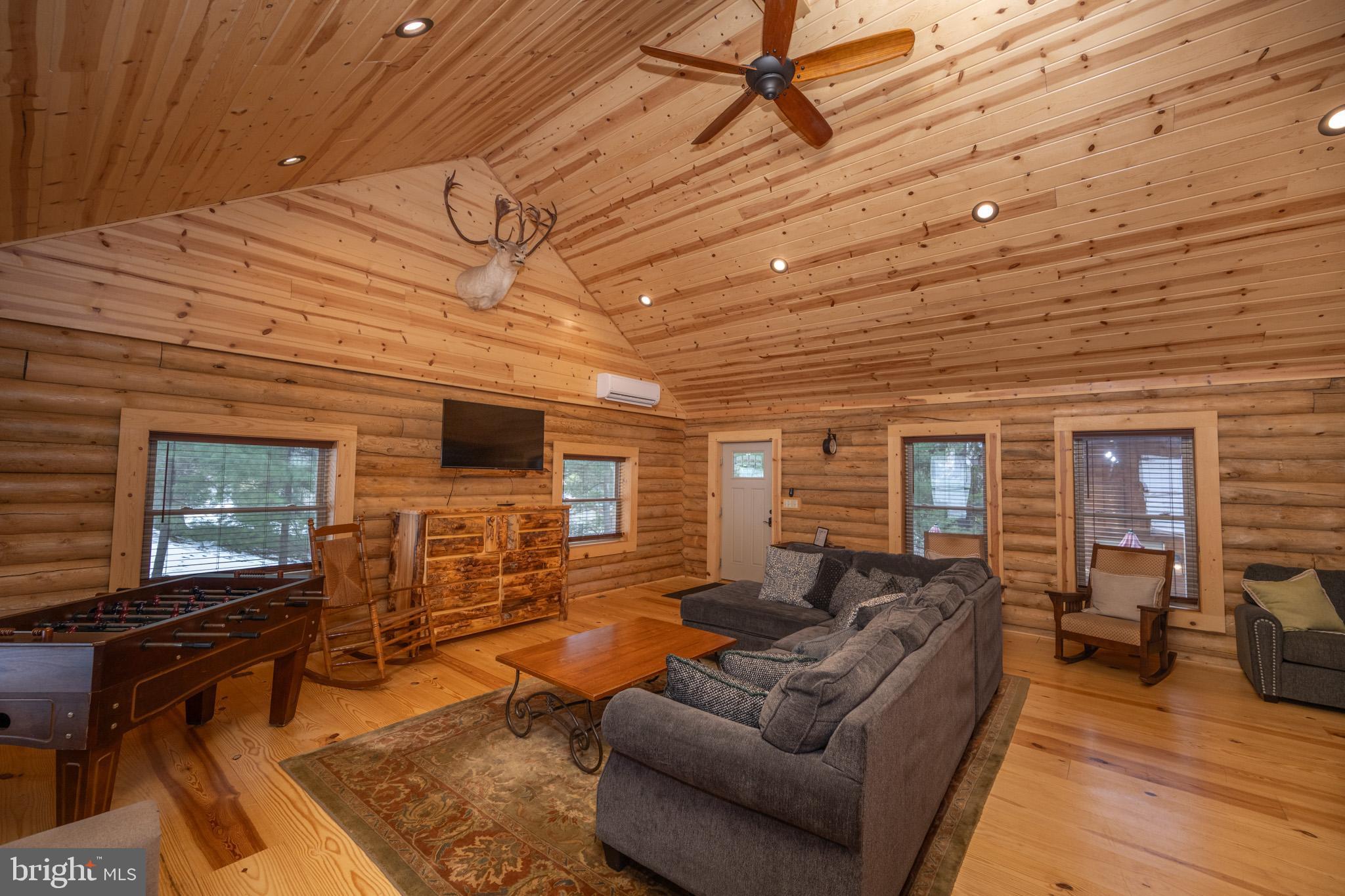 88 Gravelly Run Road McHenry, MD 21541 - Photo 67 of 79 a living room with furniture or wooden floor and a flat screen tv