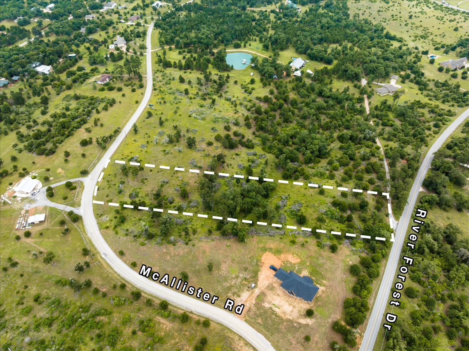 0 McAllister Road Bastrop, TX 78602 - Photo 2 of 12 Vast, undeveloped land awaits your dream home with direct road access.