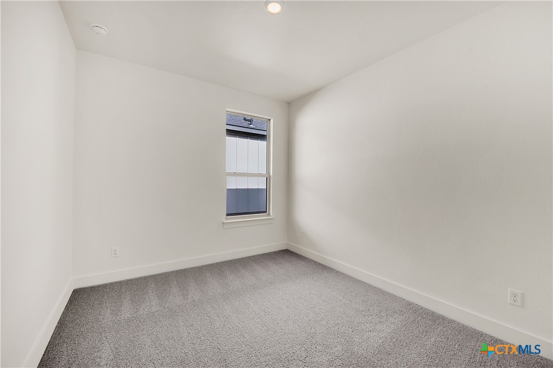 8909 Ponderosa Pine Road Temple, TX 76502 - Photo 14 of 16 a view of an empty room and a window