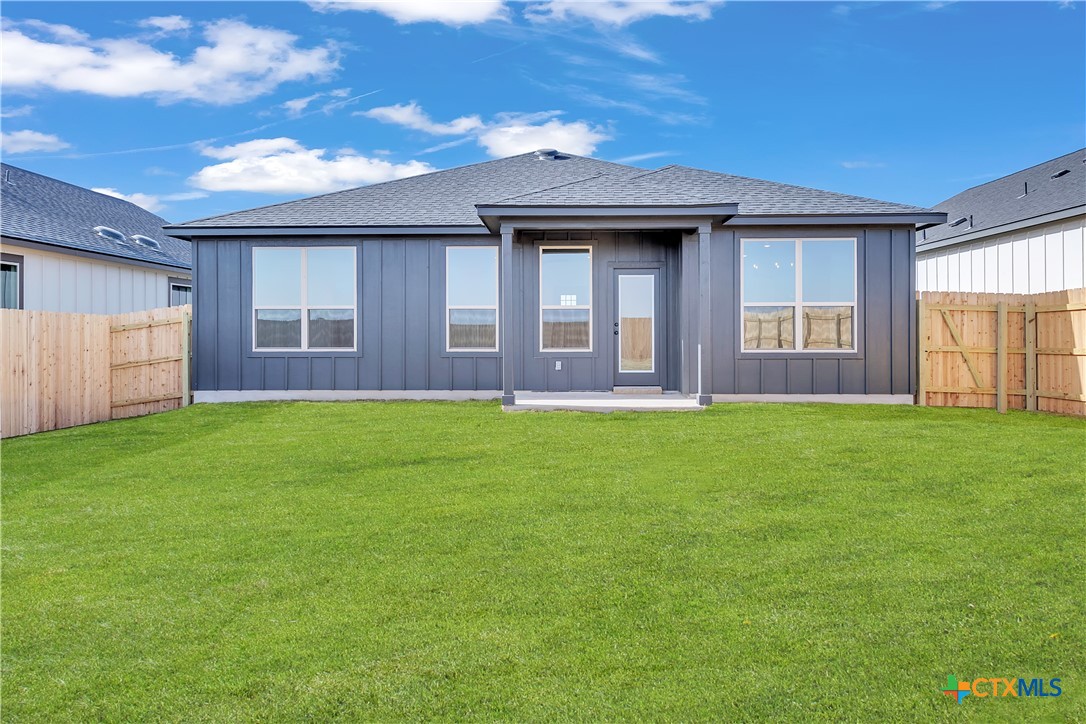 8909 Ponderosa Pine Road Temple, TX 76502 - Photo 16 of 16 a brick house next to a yard with a large tree