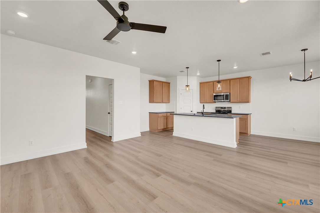 8909 Ponderosa Pine Road Temple, TX 76502 - Photo 3 of 16 a view of kitchen with microwave and cabinets