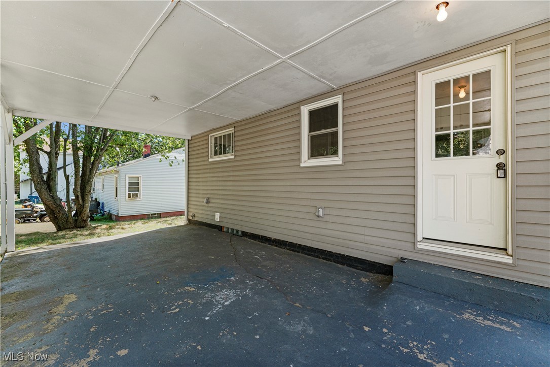 1623 Spangler Road Northeast Canton, OH 44714 - Photo 26 of 28 View of home's exterior with an attached carport and a patio