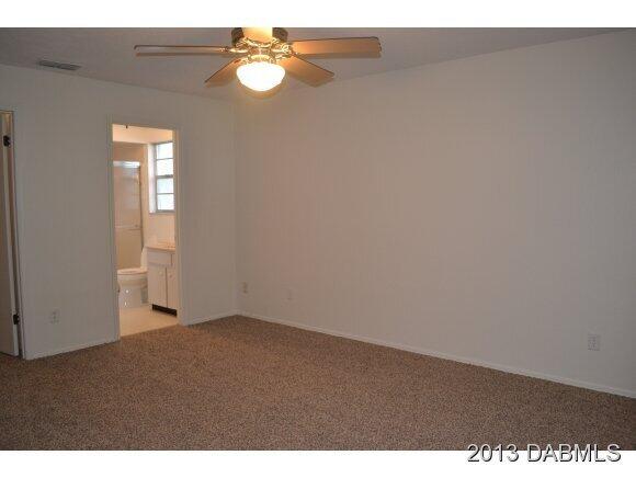 99 Mayfield Circle Ormond Beach, FL 32174 - Photo 11 of 28 a view of empty room with window
