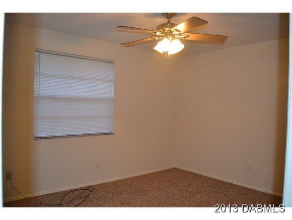 99 Mayfield Circle Ormond Beach, FL 32174 - Photo 15 of 28 a view of a room with rack on the wall