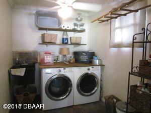 99 Mayfield Circle Ormond Beach, FL 32174 - Photo 19 of 28 a view of a kitchen with washer and dryer