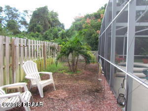 99 Mayfield Circle Ormond Beach, FL 32174 - Photo 26 of 28 a view of outdoor space with seating and green space