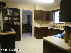 99 Mayfield Circle Ormond Beach, FL 32174 - Photo 4 of 28 a kitchen with a sink and cabinets