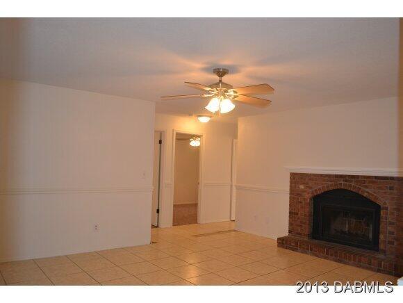 99 Mayfield Circle Ormond Beach, FL 32174 - Photo 9 of 28 a view of a livingroom with a fireplace