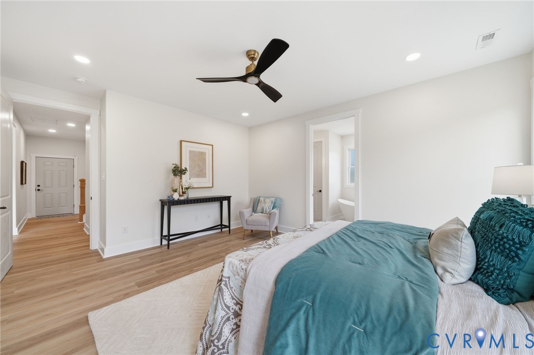 67 Hicks Wharf Road Cardinal, VA 23025 - Photo 19 of 50 a bedroom with a bed and wooden floor
