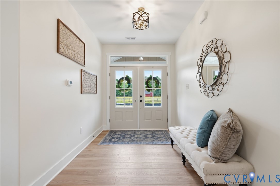 67 Hicks Wharf Road Cardinal, VA 23025 - Photo 2 of 50 a view of an entryway with wooden floor