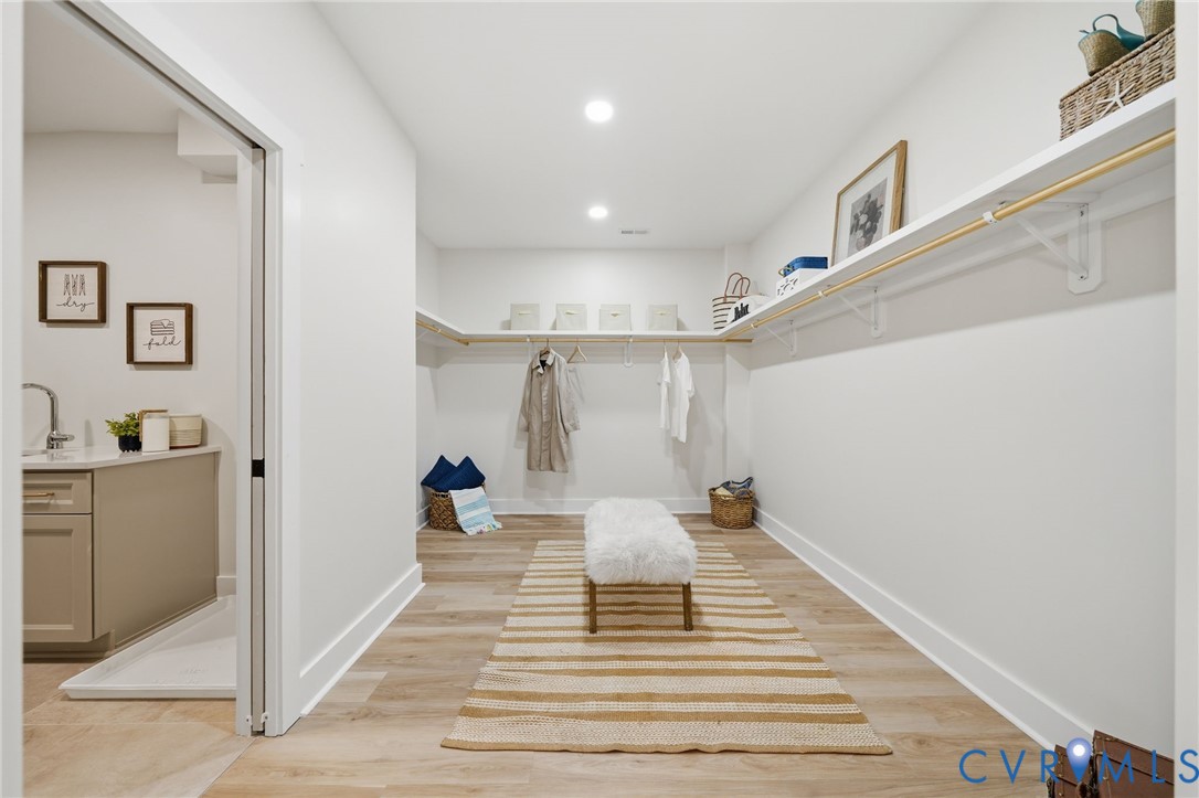 67 Hicks Wharf Road Cardinal, VA 23025 - Photo 23 of 50 a view of a hallway to a bedroom with wooden floor and furniture