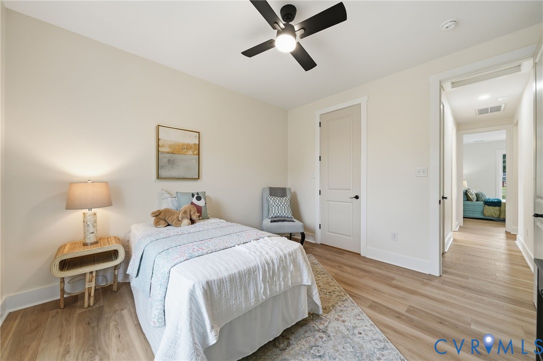 67 Hicks Wharf Road Cardinal, VA 23025 - Photo 27 of 50 a bedroom with a bed and wooden floor