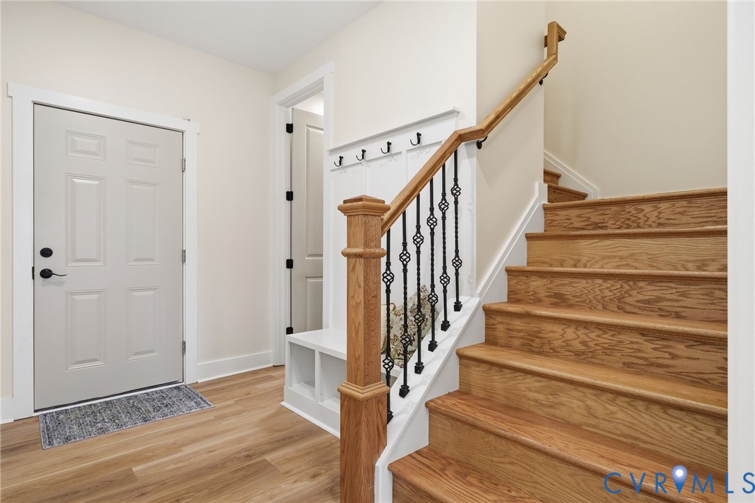 67 Hicks Wharf Road Cardinal, VA 23025 - Photo 30 of 50 a view of entryway with wooden floor and stairs