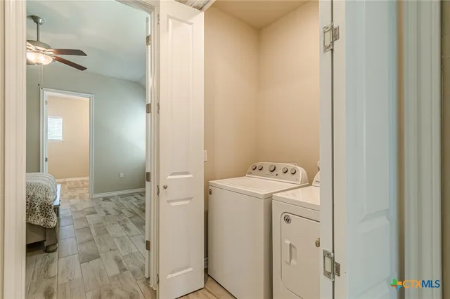 a view of bathroom with washer and dryer