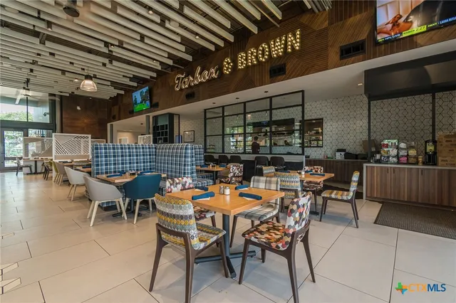 a outdoor space with lots of tables a chairs and a table