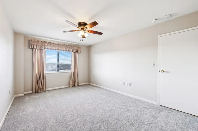 a view of a big room with carpet