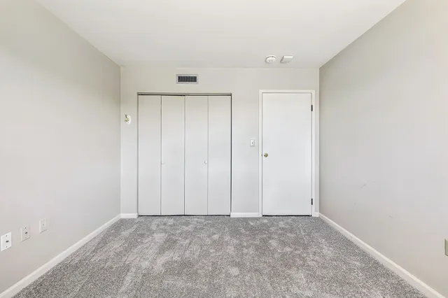 a bathroom with a sink toilet vanity and shower