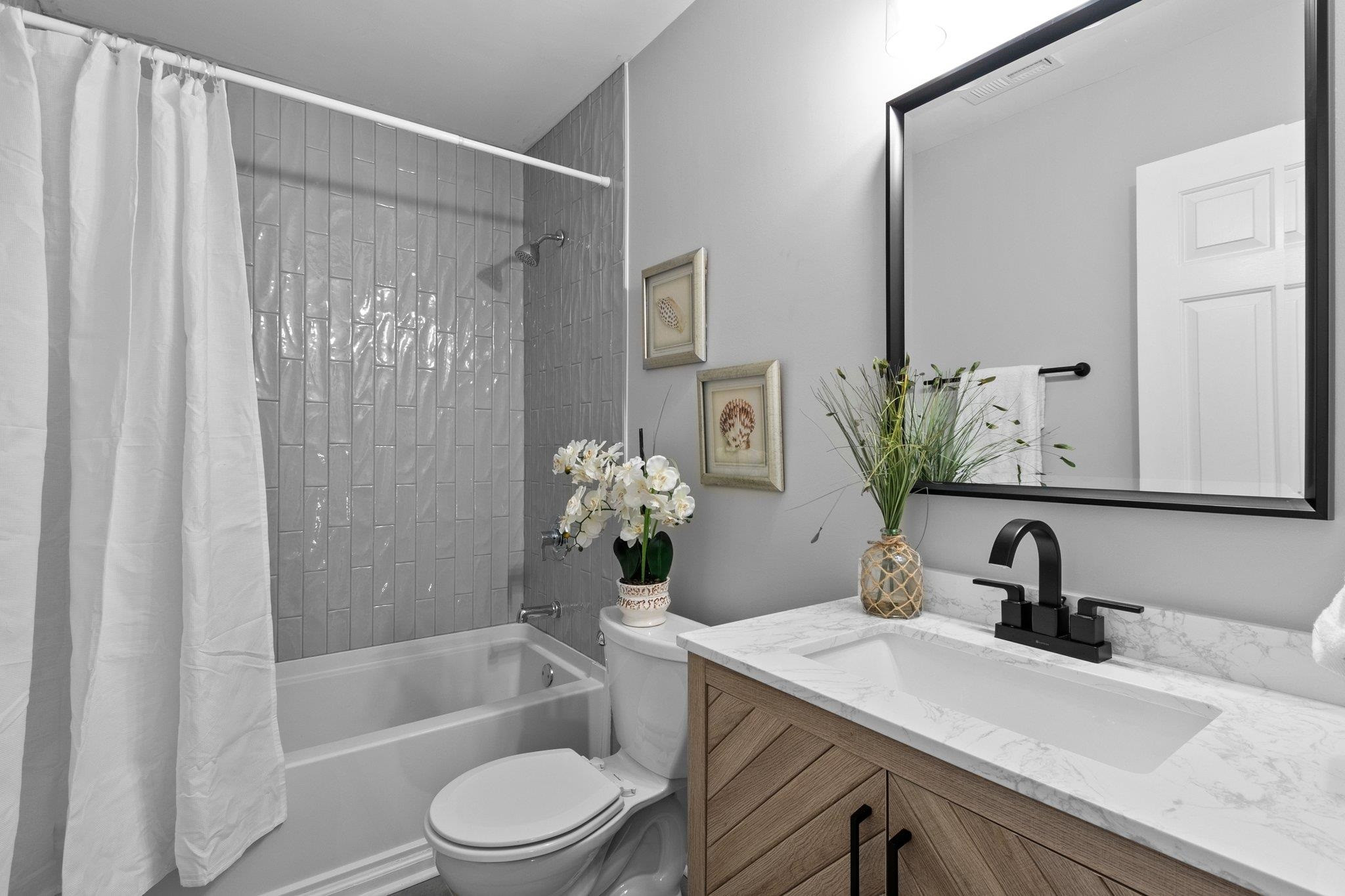 5616 Torness Court Raleigh, NC 27604 - Photo 28 of 37 Full bathroom on second floor with tub/shower combo and updated vanity. Hall Bathroom