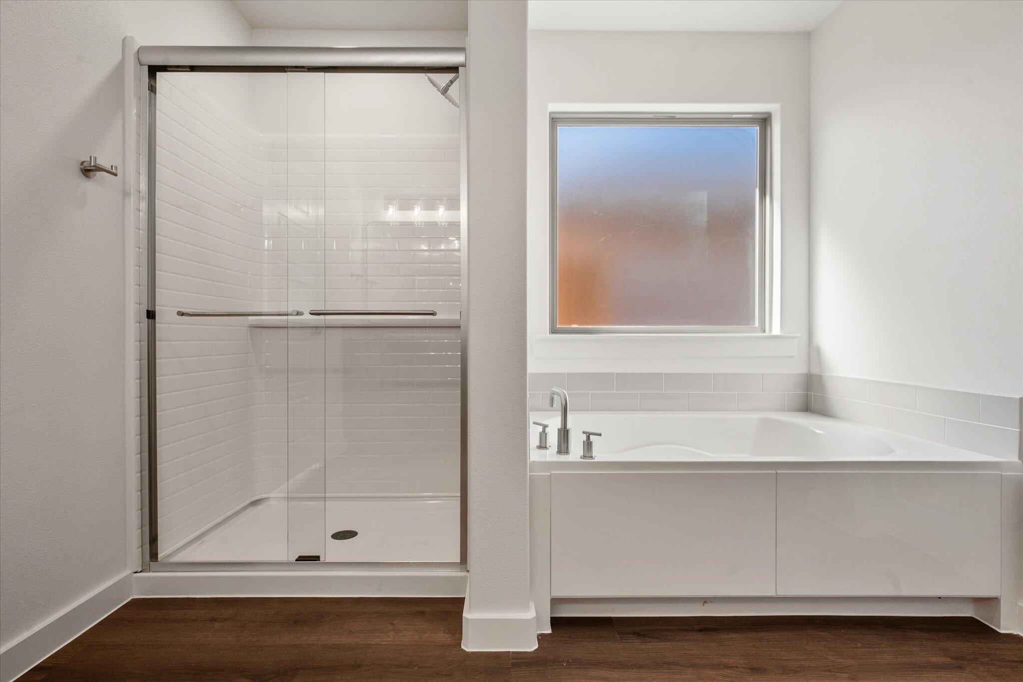 7207 7th Street Lubbock, TX 79416 - Photo 14 of 22 a bathroom with a bath tub
