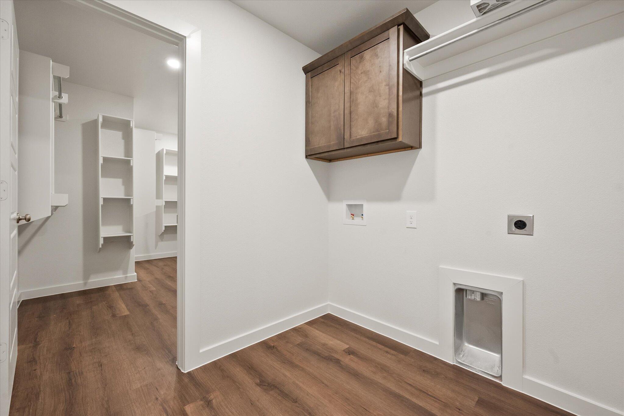 7207 7th Street Lubbock, TX 79416 - Photo 19 of 22 a view of a hallway with wooden floor and closet