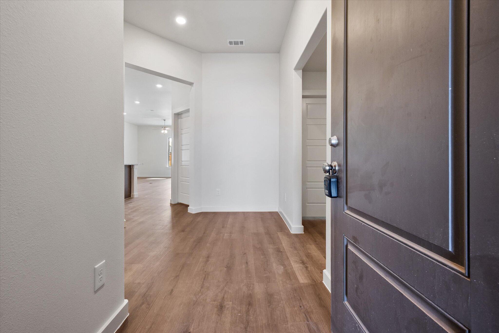 7207 7th Street Lubbock, TX 79416 - Photo 2 of 22 a view of empty room with wooden floor