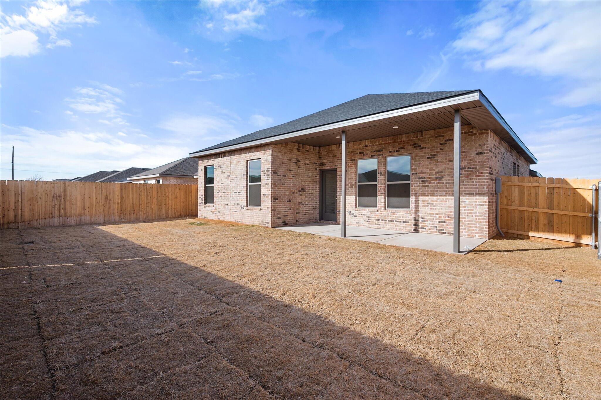 7207 7th Street Lubbock, TX 79416 - Photo 21 of 22 a front view of a house with a garage