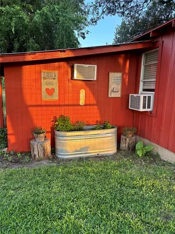 a view of a backyard with a tub