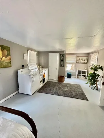 a spacious bedroom with a bed and a couch