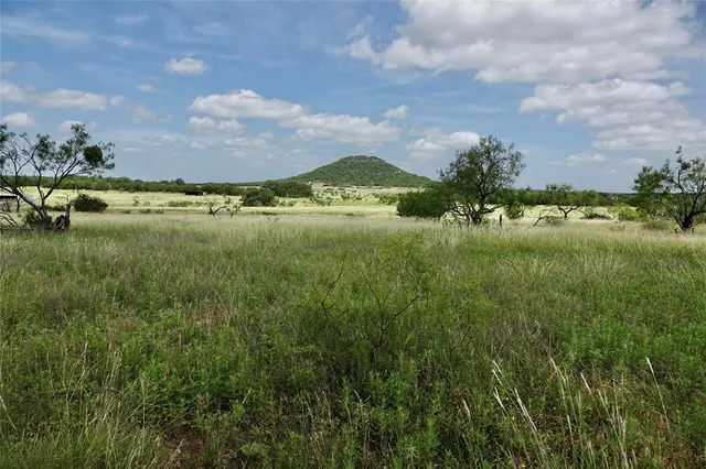 a view of a lake with a house in the background