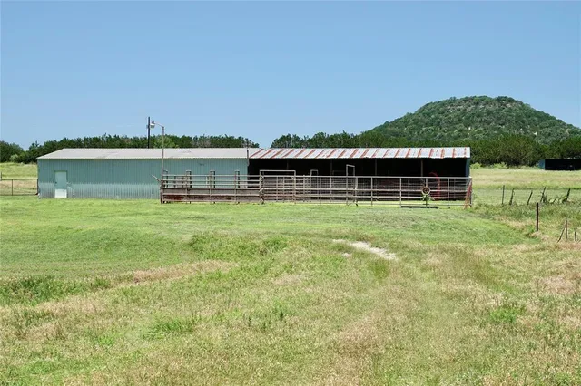 a house with swimming pool in front of it