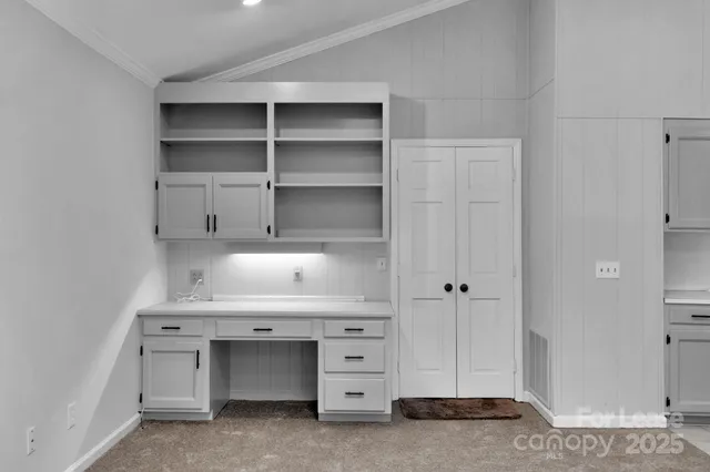 a living room with cabinets