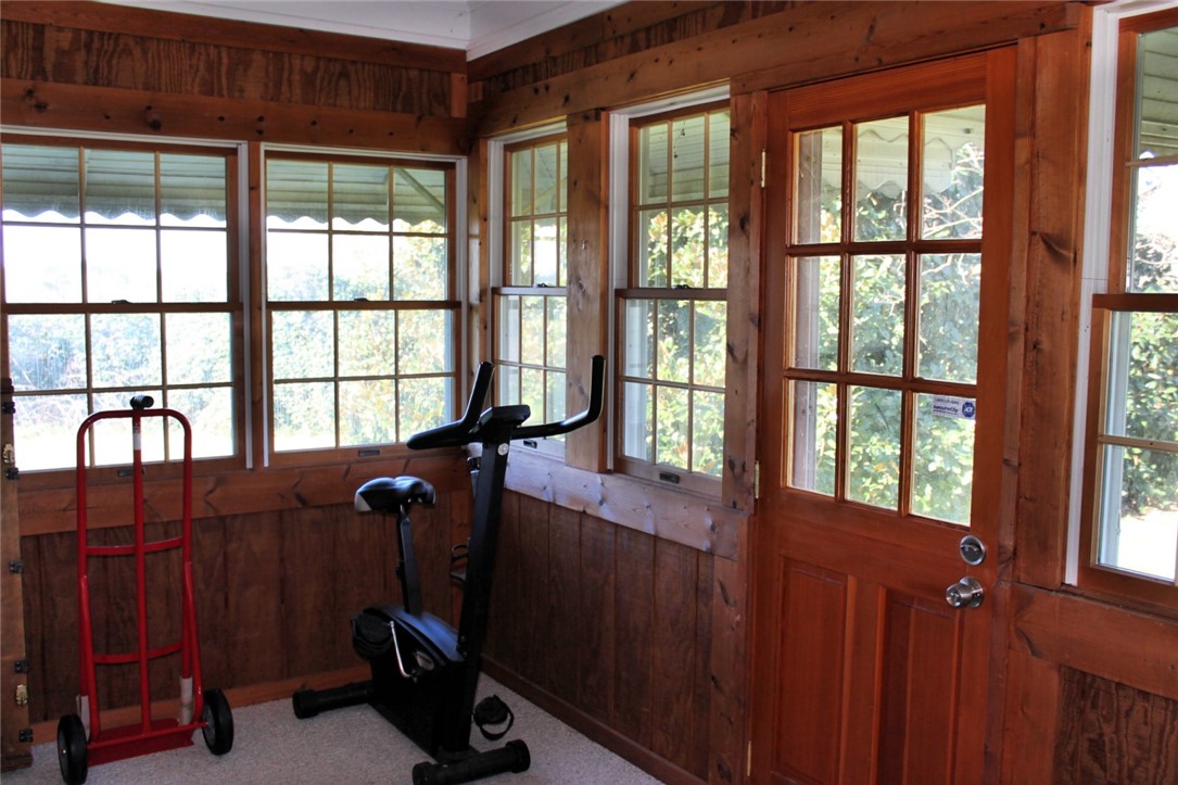228 Cedar Lane Road Westminster, SC 29693 - Photo 27 of 43 The wood paneled Sunroom is through the Living Roo
