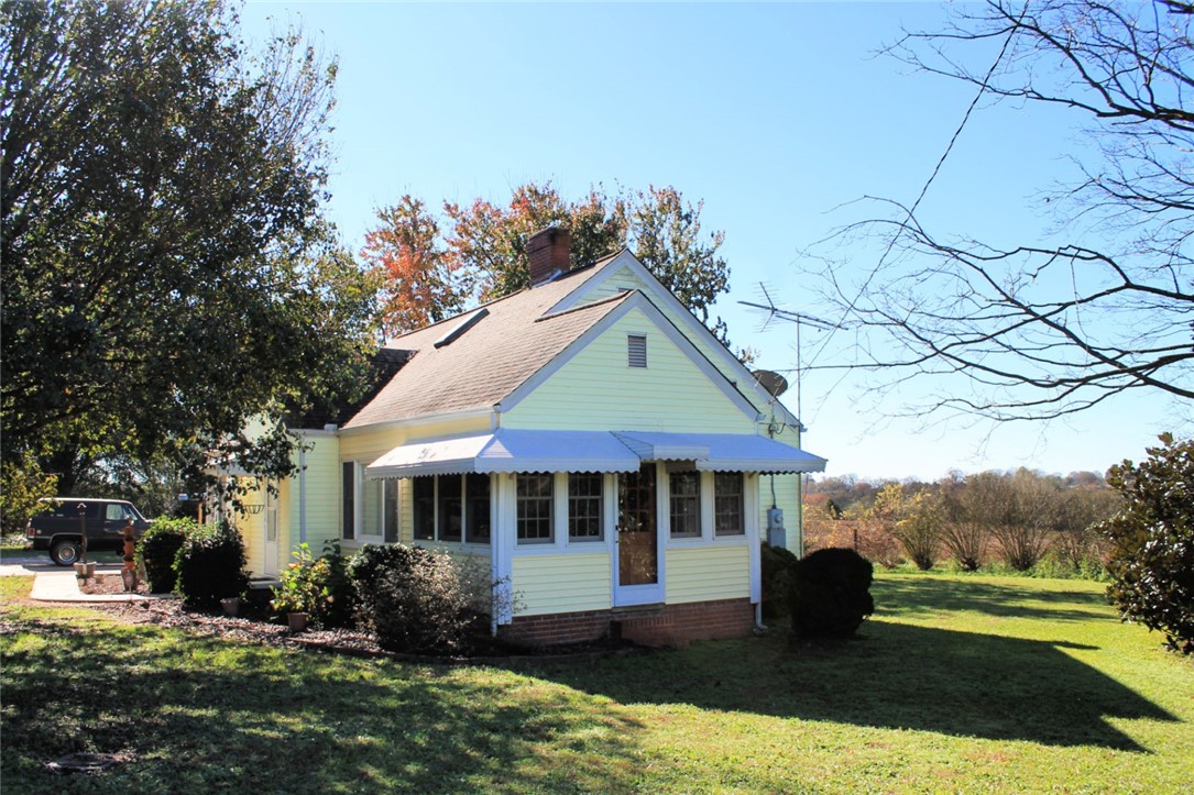 228 Cedar Lane Road Westminster, SC 29693 - Photo 6 of 43 The wood paneled Sunroom has it's own entrance.