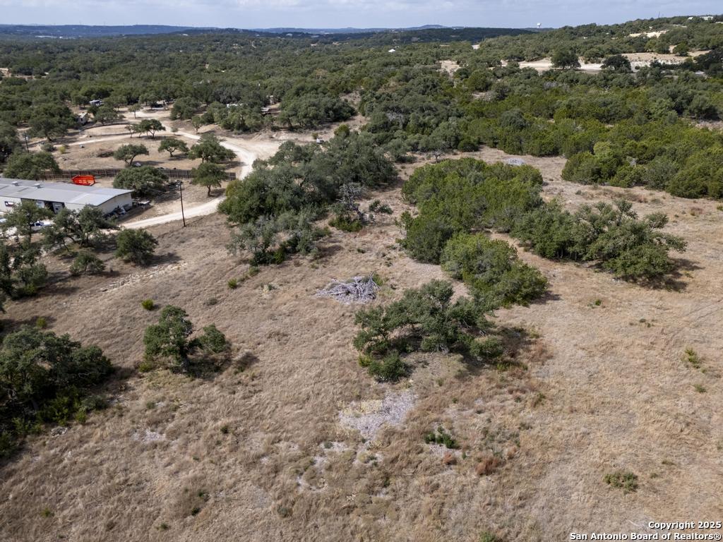 227 Mitchell Drive Spring Branch, TX 78070 - Photo 18 of 45 a view of a yard with a outdoor space