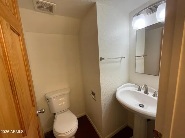 a kitchen with stainless steel appliances granite countertop a refrigerator stove and sink