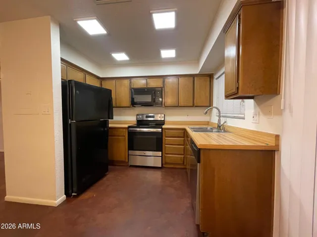 a kitchen with a stove and a microwave