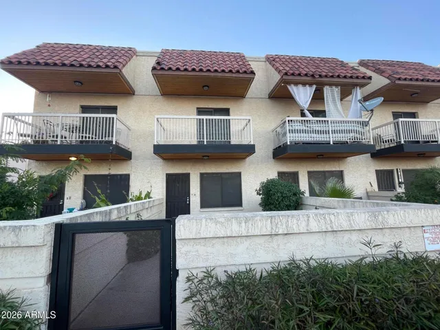 a view of a house with a iron gate