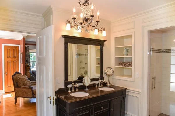 a bathroom with a sink vanity and a mirror