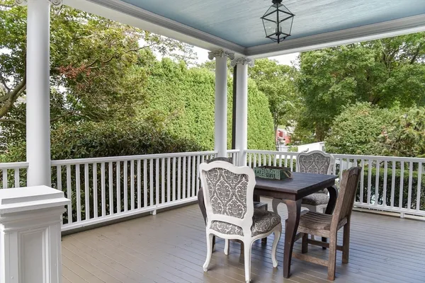 a view of a deck with a table chairs and a porch