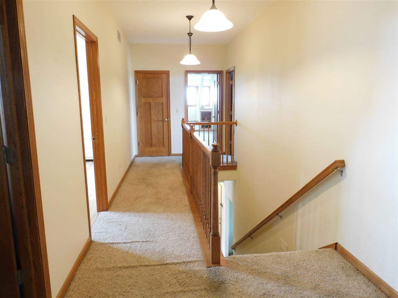 3265 Bloods Point Road Kirkland, IL 60146 - Photo 11 of 35 a view of a hallway with a chandelier