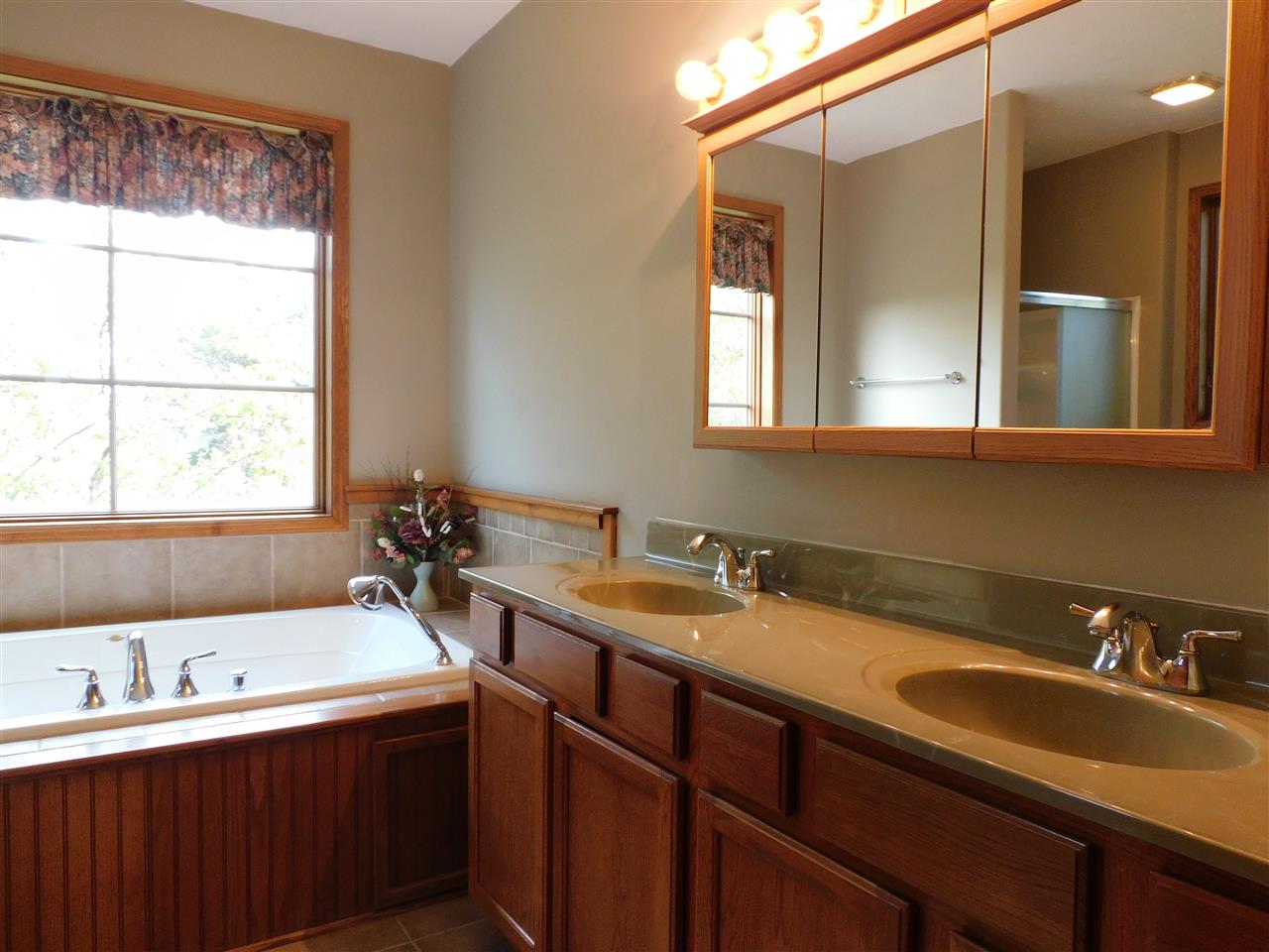 3265 Bloods Point Road Kirkland, IL 60146 - Photo 14 of 35 a bathroom with a sink and a window