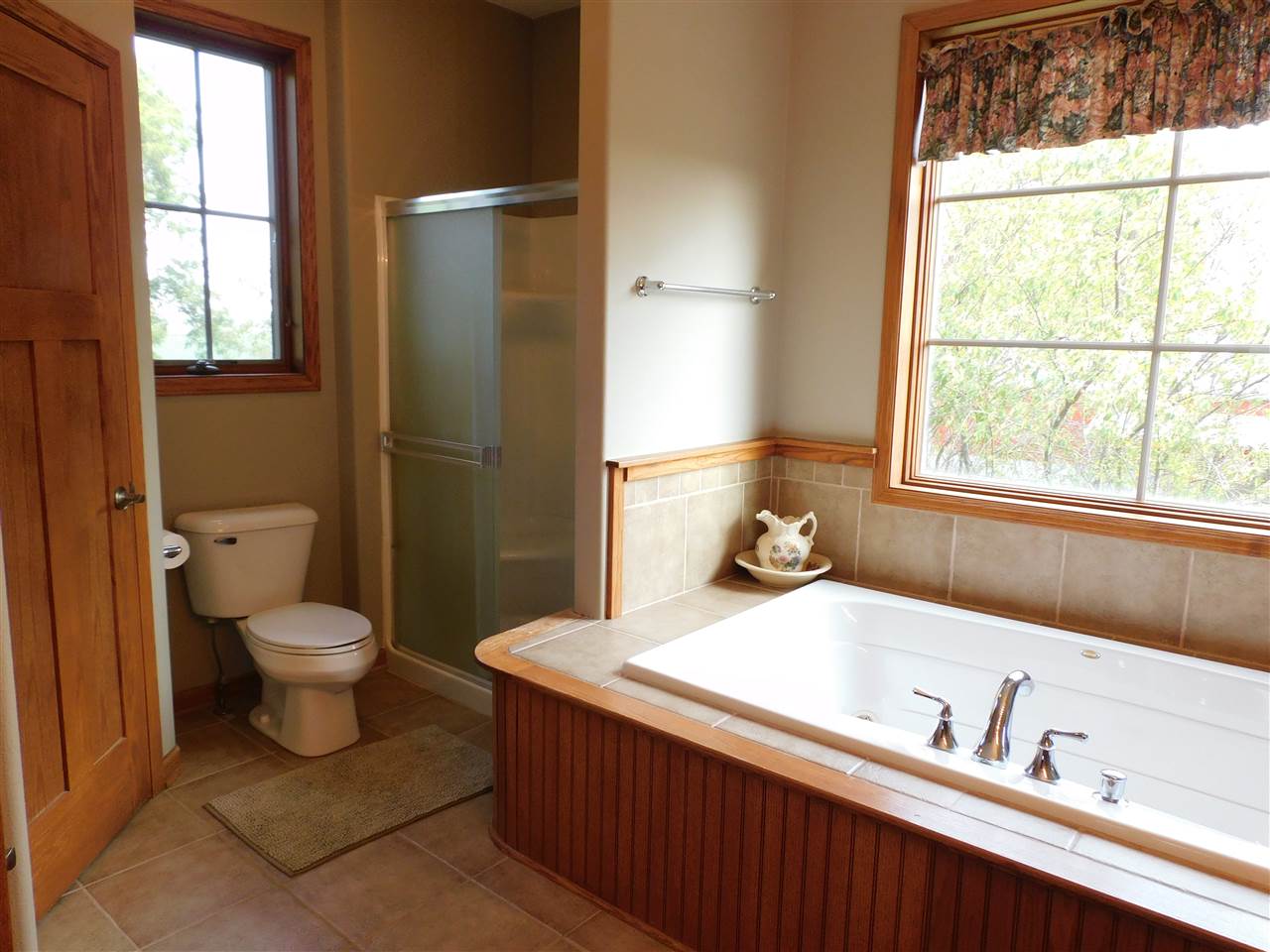 3265 Bloods Point Road Kirkland, IL 60146 - Photo 15 of 35 a bathroom with a toilet sink a mirror and next to a window